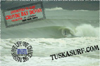 Photo of surf and surfing barrelling wave at croyde bay devon england