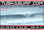 Photo of surf and surfing barrelling wave at croyde bay devon england