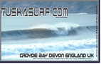 Photo of surf and surfing barrelling wave at croyde bay devon england
