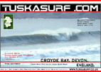 Photo of surf and surfing barrelling wave at croyde bay devon england
