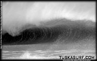 Tubing surf and surfing photos of waves in Black and white