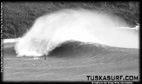 Tubing surf and surfing photos of waves in Black and white