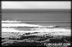 Tubing surf and surfing photos of waves in Black and white