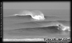 Tubing surf and surfing photos of waves in Black and white