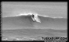 Tubing surf and surfing photos of waves in Black and white