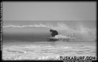 Tubing surf and surfing photos of waves in Black and white
